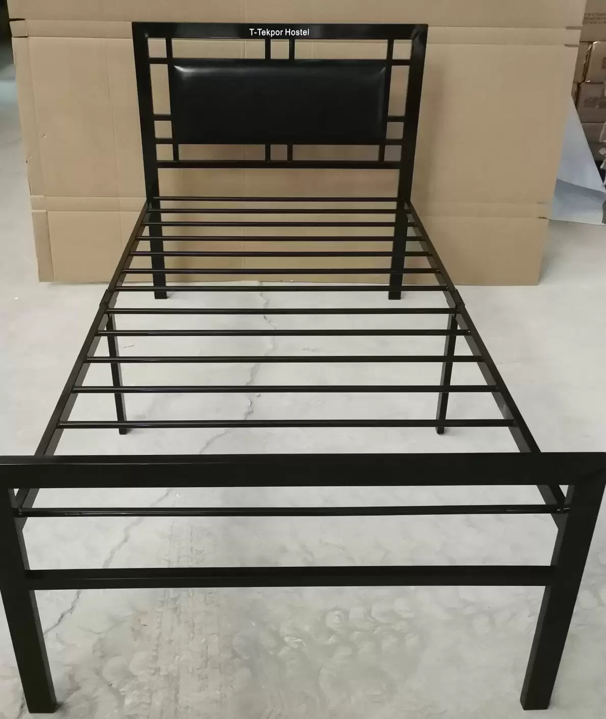 Custom black metal bed frame with T-Tekpor branded PU headboard